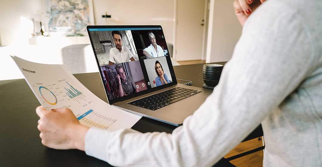 woman on laptop video conference call looking at report, working from home laws