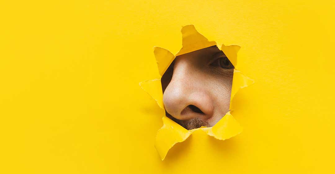 nose peeking through torn yellow paper, snooping, hacking during divorce