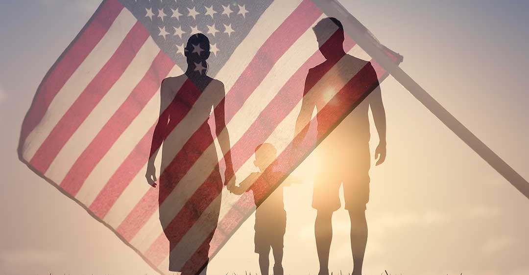 Patriotic family walking together on American flag background, family sponsored immigration