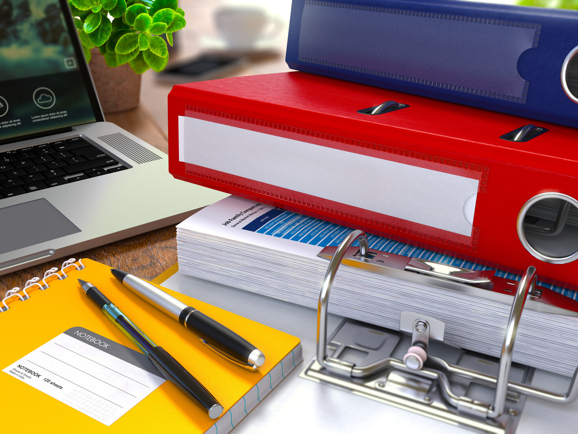 laptop and red ring binder, new florida litigation rules, differentiated case management
