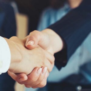 businesswoman shaking hands with businessman, commercial transactions