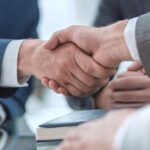 businessmen shaking hands, making a deal, business and commercial services