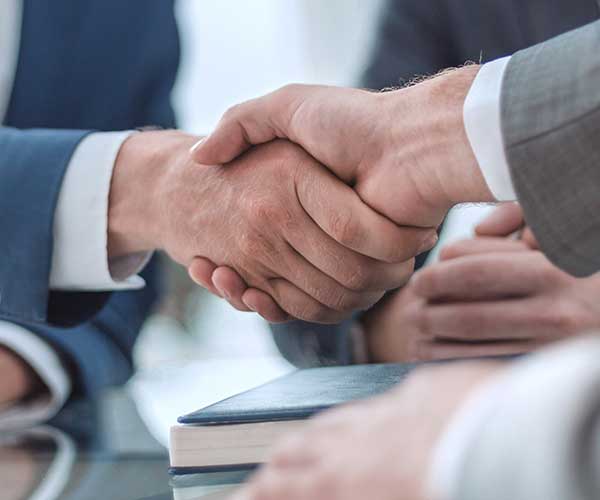 businessmen shaking hands, making a deal, business and commercial services