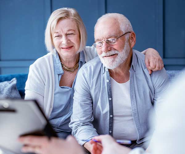 elderly husband and wife reviewing estate plan, estate planning