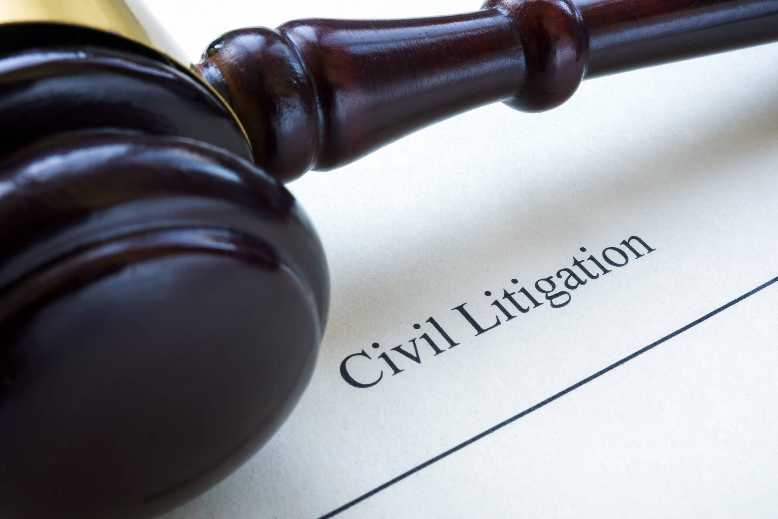 Close up of civil litigation document and gavel