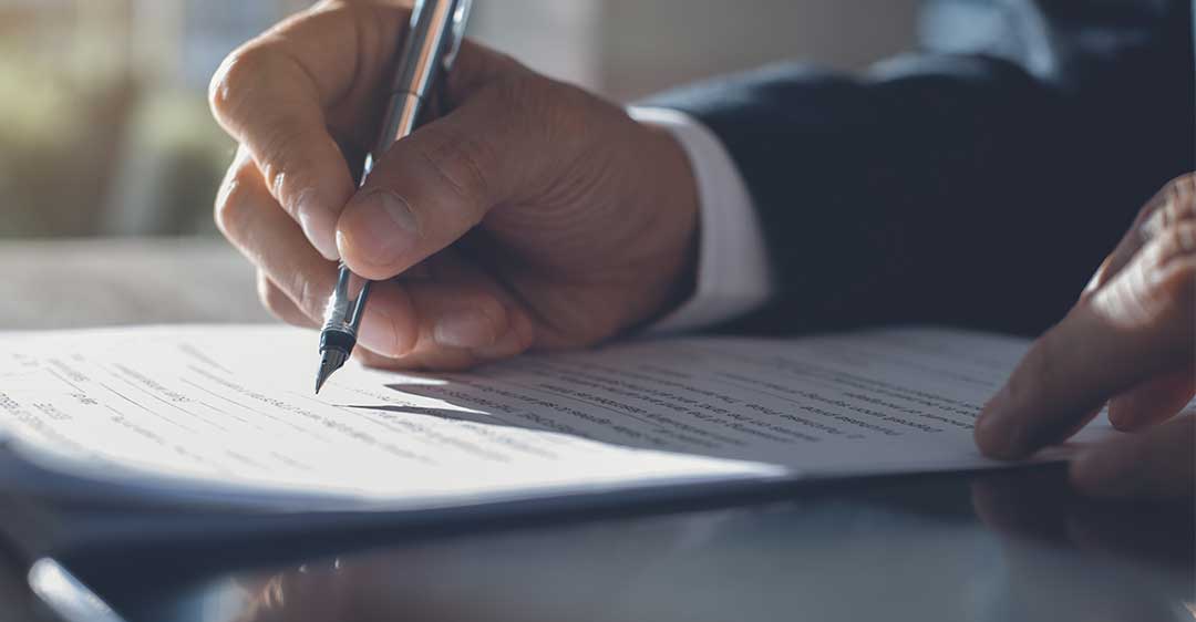 businessman signing document, non-compete agreements